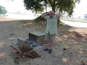 The bushsnob just discovered the bomb dropped by the "terrorist" elephant and he is horrified thinking on cleaning the mess.